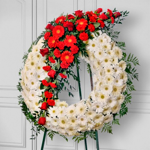 Corona fúnebre de margaritas blancas con gerberas, rosas, claveles rojos